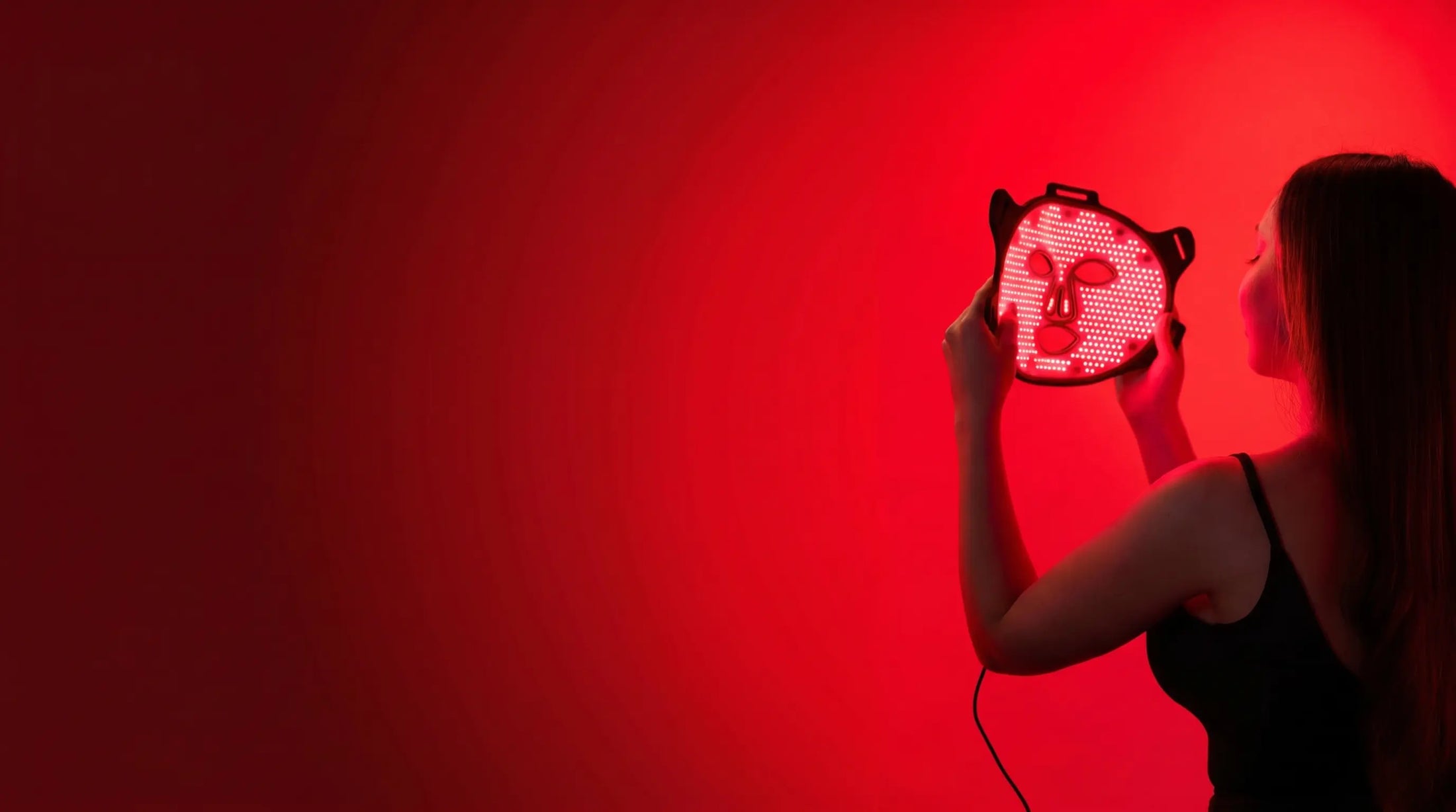 Lumara VISO red light therapy mask in use